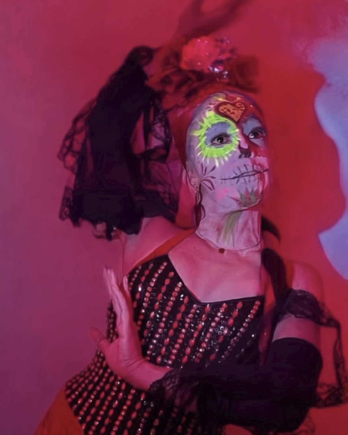 Dramatic red smoke sugar skull portrait looking up